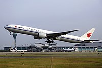 A Boeing 777-300ER in the current livery used on Boeing aircraft, which the phoenix logo was enlarged and straightened. 